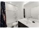 Clean and modern bathroom with tub/shower combo, white vanity, and elegant fixtures at 355 Walker Avenue, Roswell, GA 30076