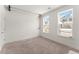 Bright bedroom with two windows allowing lots of natural light and neutral carpeted flooring at 355 Walker Avenue, Roswell, GA 30076