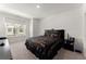 Bright bedroom with a black headboard, decorative bedding, and a large window at 355 Walker Avenue, Roswell, GA 30076