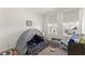 Cozy bedroom featuring carpeted floors, two windows, play tent and toys at 355 Walker Avenue, Roswell, GA 30076