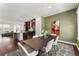 Open-concept dining room leading to kitchen and living area, perfect for entertaining at 355 Walker Avenue, Roswell, GA 30076
