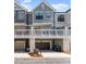 Close-up showcasing townhome exteriors with garages, balconies, and landscaping contributing to curb appeal at 355 Walker Avenue, Roswell, GA 30076