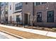 Attractive townhome exterior with brick facade, black accents, and fresh landscaping at 355 Walker Avenue, Roswell, GA 30076