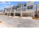 Attractive townhome exteriors showcasing covered patios and garages providing a blend of aesthetics and function at 355 Walker Avenue, Roswell, GA 30076