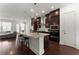 Open-concept kitchen with granite counters, stainless appliances, and breakfast bar seating at 355 Walker Avenue, Roswell, GA 30076
