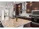 Modern kitchen featuring granite countertops, stainless steel appliances, and dark wood cabinetry at 355 Walker Avenue, Roswell, GA 30076