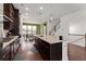 Modern kitchen with granite countertops, stainless steel appliances, and open to dining area at 355 Walker Avenue, Roswell, GA 30076