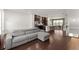 Spacious living room with hardwood floors, sofa, and open kitchen/dining area at 355 Walker Avenue, Roswell, GA 30076