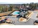 Overhead view of a community pool and clubhouse with parking, landscaping and community features at 355 Walker Avenue, Roswell, GA 30076
