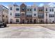 Charming townhomes with a brick and siding facade, black trim, and well-manicured landscaping at 355 Walker Avenue, Roswell, GA 30076