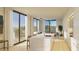 Open-concept living space with a kitchen featuring a large island, stainless appliances, and floor-to-ceiling windows at 318 Sandy Springs Cir # 220, Sandy Springs, GA 30328