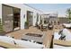 Outdoor rooftop patio with a fire pit, lounge seating, a dining table, and an outdoor kitchen area at 318 Sandy Springs Cir # 220, Sandy Springs, GA 30328