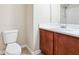 Bathroom with a vanity, toilet, and shower with tile surround at 1309 Avington Glen Dr, Lawrenceville, GA 30045