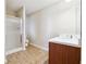 Bright bathroom with a glass shower, single sink vanity, and tile floor at 1309 Avington Glen Dr, Lawrenceville, GA 30045