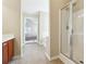 Bathroom showcasing a shower, vanity, and doorway leading to another room at 1309 Avington Glen Dr, Lawrenceville, GA 30045