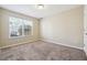 Neutral bedroom featuring a window and carpet at 1309 Avington Glen Dr, Lawrenceville, GA 30045