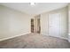Bedroom with carpeted floor, one window with blinds, and neutral paint at 1309 Avington Glen Dr, Lawrenceville, GA 30045