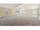 Spacious carpeted bonus room with vaulted ceilings and multiple windows at 1309 Avington Glen Dr, Lawrenceville, GA 30045