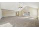 Open bonus room with vaulted ceiling, carpet, and natural light from windows at 1309 Avington Glen Dr, Lawrenceville, GA 30045