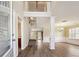 Grand foyer featuring hardwood floors, wainscoting and an open staircase at 1309 Avington Glen Dr, Lawrenceville, GA 30045