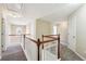 Hallway with carpeted floor, white railing, and neutral paint at 1309 Avington Glen Dr, Lawrenceville, GA 30045