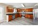 Updated kitchen with stainless steel appliances, ample cabinet space, and granite counters at 1309 Avington Glen Dr, Lawrenceville, GA 30045