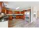Modern kitchen with stainless steel appliances, granite counters, and hardwood floors at 1309 Avington Glen Dr, Lawrenceville, GA 30045