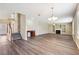 Expansive living room featuring hardwood floors, fireplace, built-in shelving and natural light at 1309 Avington Glen Dr, Lawrenceville, GA 30045