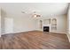 Inviting living area boasting hardwood floors, a fireplace, and custom built-in shelving at 1309 Avington Glen Dr, Lawrenceville, GA 30045