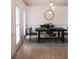 Modern dining room with stylish lighting fixtures and hardwood floors at 2552 Forest Meadow Ln, Lawrenceville, GA 30043