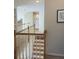 Hallway with hardwood stairs and modern railing, providing a sense of flow at 2552 Forest Meadow Ln, Lawrenceville, GA 30043