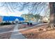 Community pool area featuring a fenced pool and clubhouse with a bright blue roof, providing a vibrant gathering space at 2552 Forest Meadow Ln, Lawrenceville, GA 30043