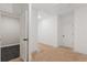A spacious hallway with doorways, and neutral tones providing a transition between different areas of the home at 304 Trecastle Ln # 28, Canton, GA 30114