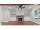 Inviting living room with a cozy fireplace, exposed wood beams, and built-in shelving at 304 Trecastle Ln # 28, Canton, GA 30114