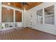 A beautiful wooden-floored patio with a ceiling fan, perfect for outdoor relaxation and entertainment at 304 Trecastle Ln # 28, Canton, GA 30114
