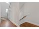 Staircase with dark wood floors, wood railings, and white posts and spindles at 304 Trecastle Ln # 28, Canton, GA 30114