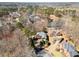 Aerial view of neighborhood with lake, large houses, and golf course in the background at 511 Newburgh Way, Roswell, GA 30075