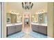 Beautiful primary bathroom offering dual vanities with large mirrors and modern lighting at 511 Newburgh Way, Roswell, GA 30075