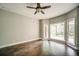 Spacious bedroom featuring gleaming hardwood floors, neutral paint and a ceiling fan at 511 Newburgh Way, Roswell, GA 30075