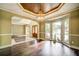 Elegant dining room with coffered ceilings, a chandelier, and bay windows at 511 Newburgh Way, Roswell, GA 30075