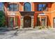 Stunning two-story home with a custom stone and wood door entrance at 511 Newburgh Way, Roswell, GA 30075