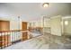 Wide-open landing with railing overlooking the floor below, neutral carpet and paint at 511 Newburgh Way, Roswell, GA 30075