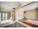 Sun-filled living room with hardwood floors, recessed lighting, and a glass-door to the outside at 511 Newburgh Way, Roswell, GA 30075