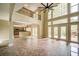 Bright living room with large windows, a fireplace, and an open floor plan at 511 Newburgh Way, Roswell, GA 30075