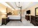 Carpeted main bedroom featuring tray ceiling, fan, and ample closet space at 511 Newburgh Way, Roswell, GA 30075