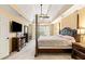 Beautiful main bedroom with tray ceilings, carpet, ceiling fan, and four poster bed at 511 Newburgh Way, Roswell, GA 30075