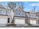 Attractive townhome showcasing a gray exterior, a pristine lawn, and an attached two-car garage at 686 Smokey Quartz Way, Kennesaw, GA 30144