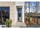 Stylish front door with modern accents, leading to a beautifully designed home at 686 Smokey Quartz Way, Kennesaw, GA 30144