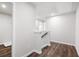 Hallway with wood-look floors, white walls, and staircase at 686 Smokey Quartz Way, Kennesaw, GA 30144