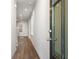 Bright hallway featuring hardwood floors, leading to living areas with an open-concept design at 686 Smokey Quartz Way, Kennesaw, GA 30144